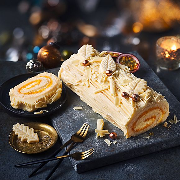 	 M&S white chocolate and passionfruit yule log on grey slate