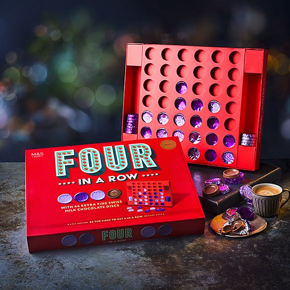 M&S Four in a Row chocolate game with dark background