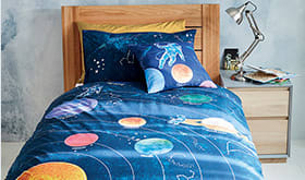 Wooden bed with children’s bedding