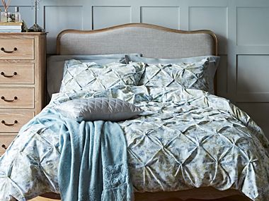 Bed with embroided duvet cover