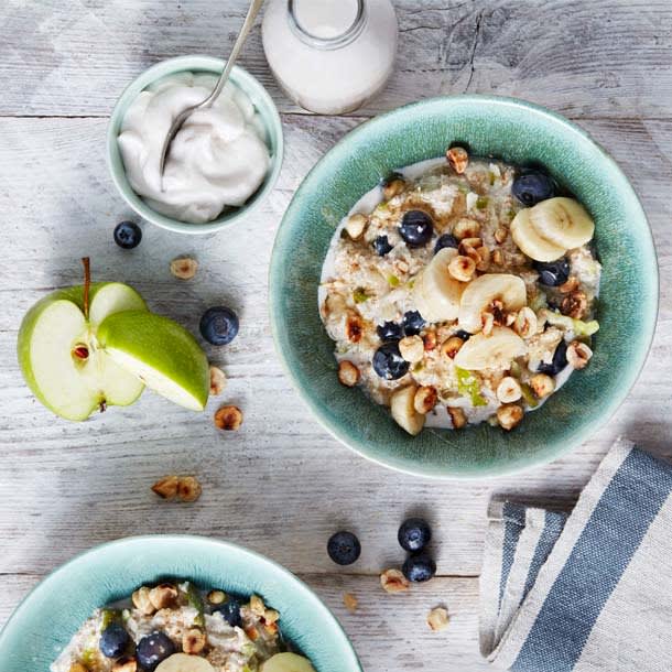 Bowls of bircher muesli with apple slices