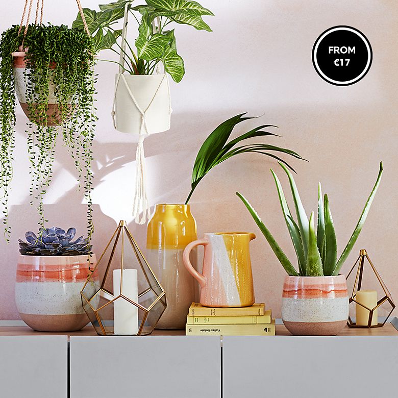 Colourful ceramic vases and planters on Jones white and wood sideboard