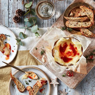 Baked camembert with a sweet chilli glaze and sliced sourdough bread