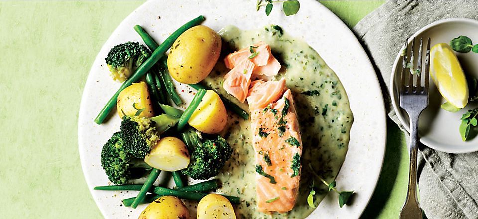Salmon in a white sauce with new potatoes, green beans and broccoli 