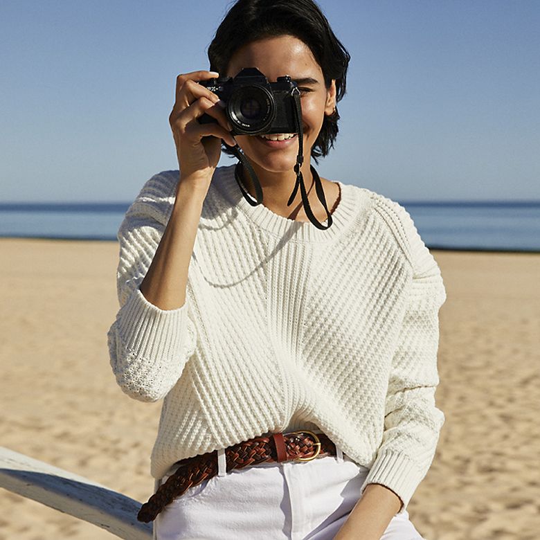 Woman wearing white knitted jumper
