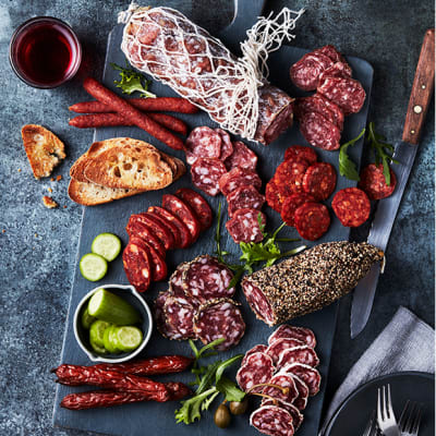 A slate board filled with charcuterie