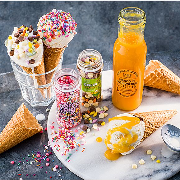 Ice creams topped with sprinkles and coulis