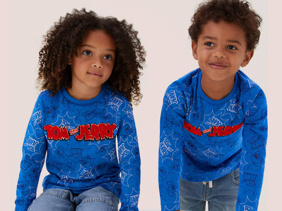 Two children wearing blue Tom and Jerry tops