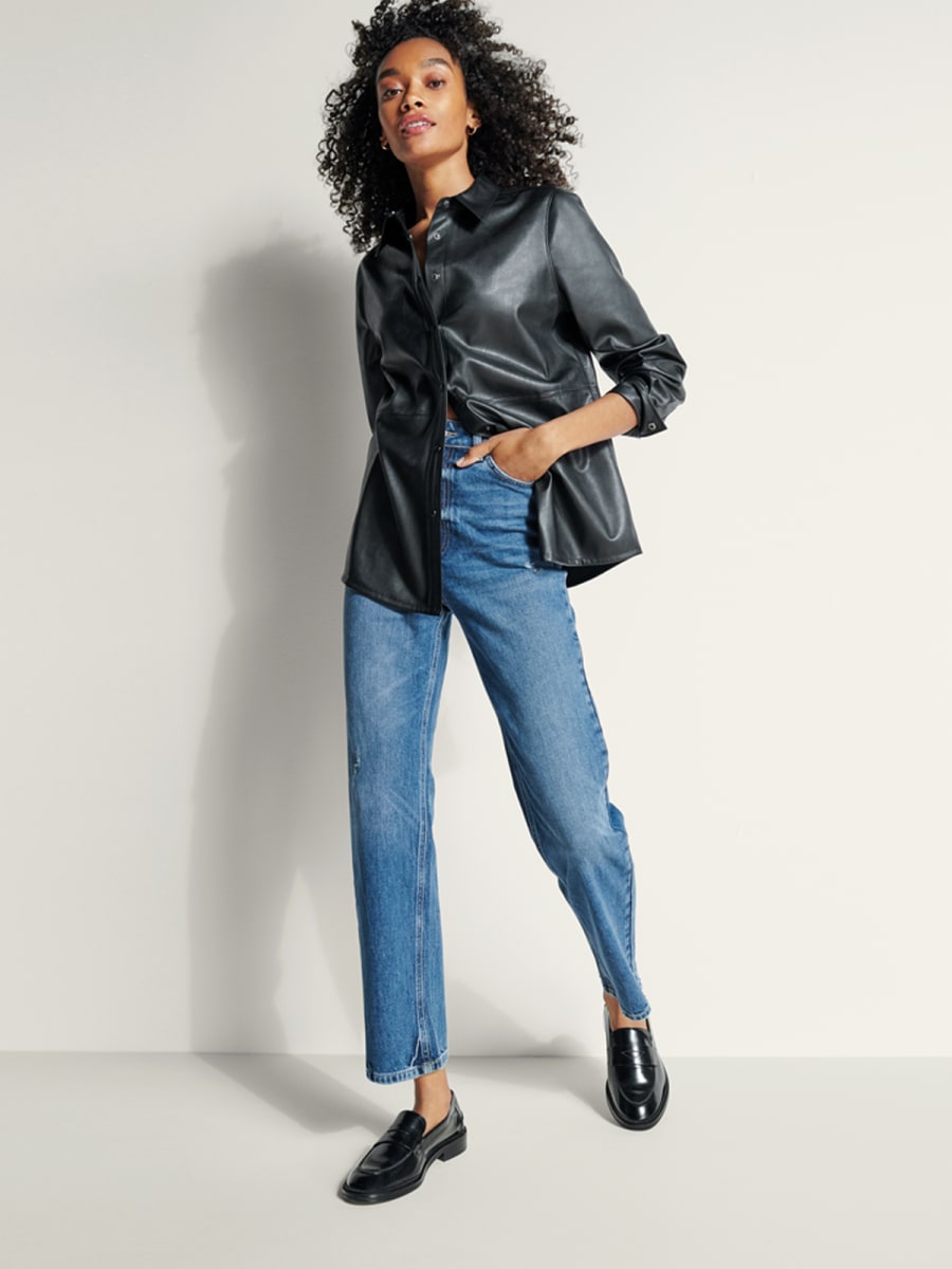 Woman wearing M&S jeans with a blouse