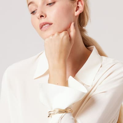 Woman wearing gold bracelet