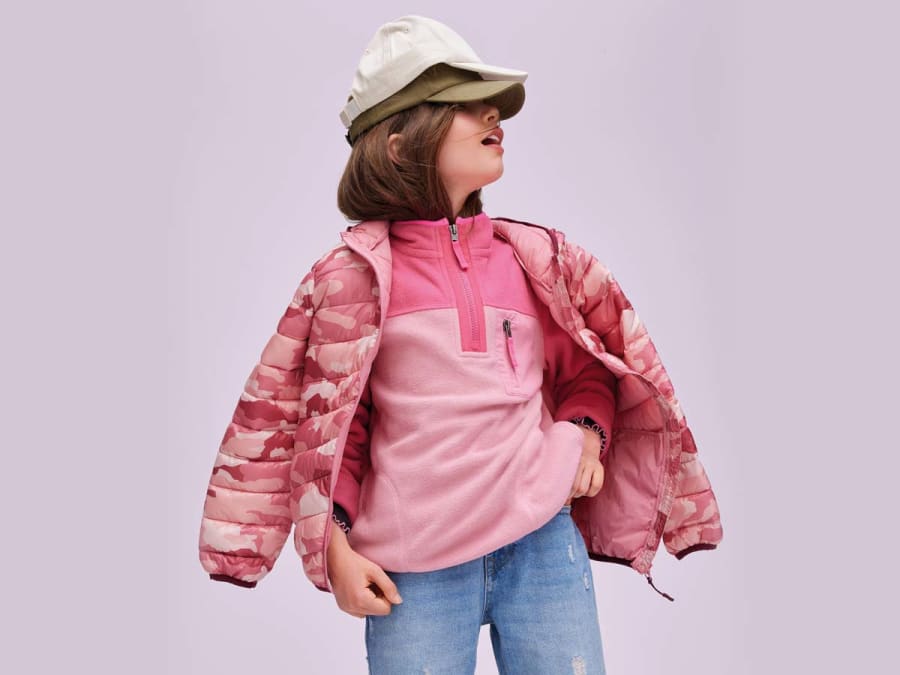 Girl wearing pink M&S camo puffer jacket