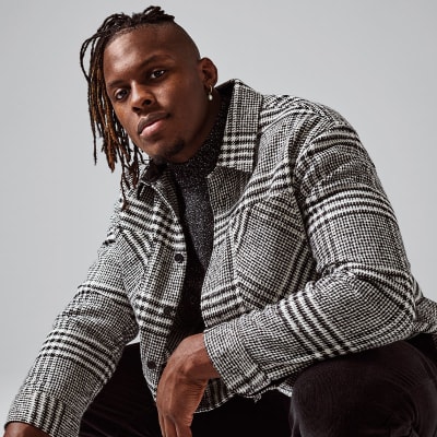 Maro Itoje wearing black and white checked overshirt