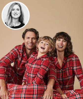 Family wearing matching red checked PJs