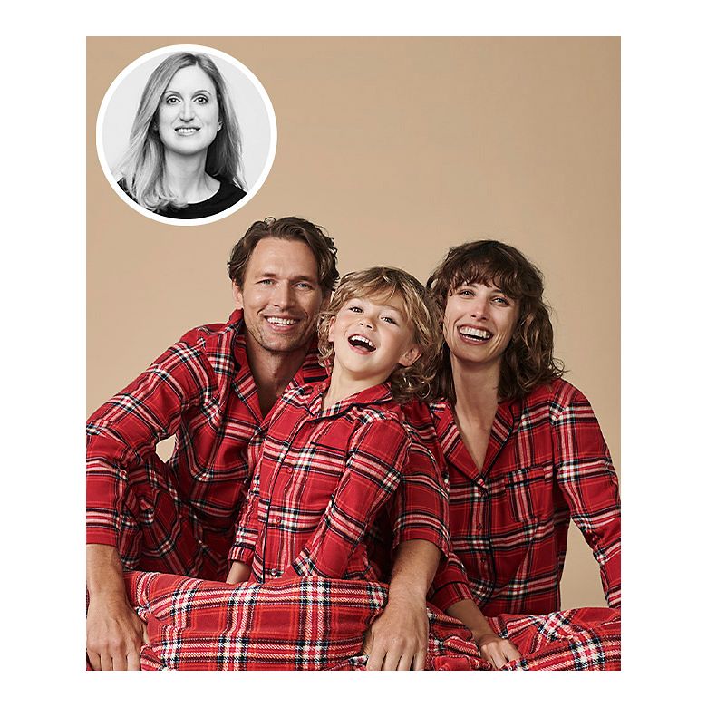Family wearing matching red checked PJs