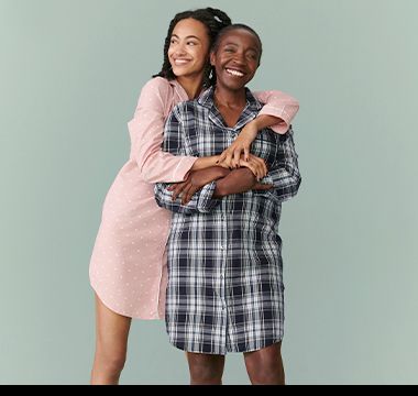 Women wearing pink spot and blue checked nightshirts
