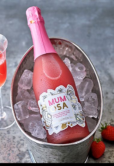 Bottled “mumosa” cocktail in an ice bucket