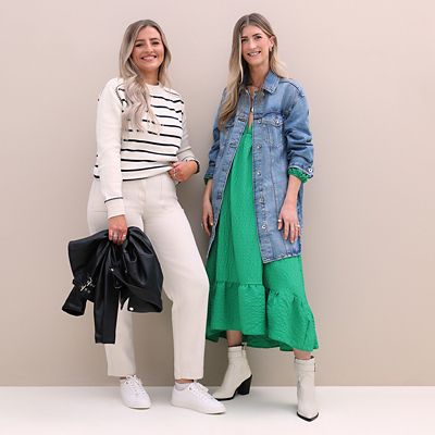 M&S Insider Jenny wearing white and black striped jumper, cream jeans and white trainers; M&S Insider Emma wearing Nobody’s Child green dress, denim jacket and Sosandar cream cowboy boots