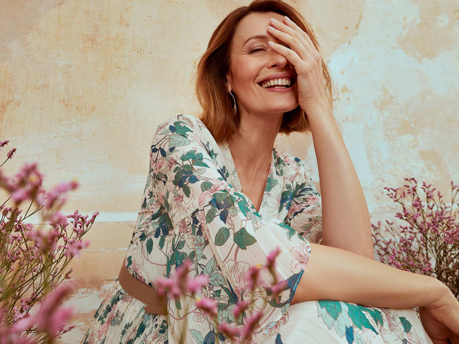 Woman wearing belted floral dress