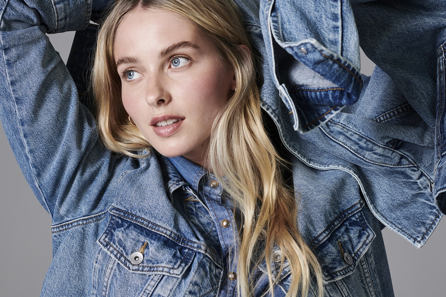 Woman wearing denim shirt and denim jacket