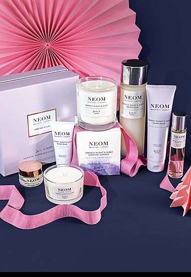 Assorted Neom candles, room diffusers and hand creams. Shop now