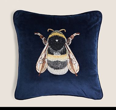 Navy velvet cushion with bee design. Shop now