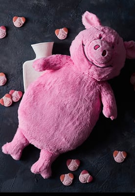 Percy Pig faux-fur hot-water bottle. Shop now