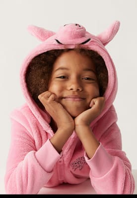 Child wearing Percy Pig pink hooded onesie. Shop now