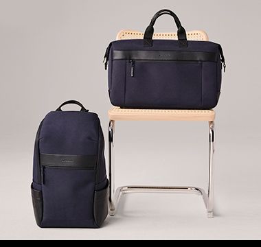 A selection of Autograph black and navy travel luggage. Shop now.