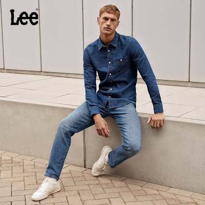 Man wearing blue denim shirt and jeans by Lee. Shop Lee at M&S. 