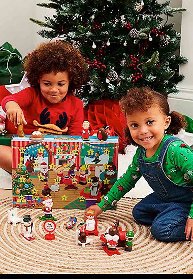 Two children playing with the Happyland advent calendar. Shop now 