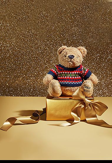Spencer Bear plush teddy with knitted jumper and embroidered paw. Shop Spencer Bear gifts