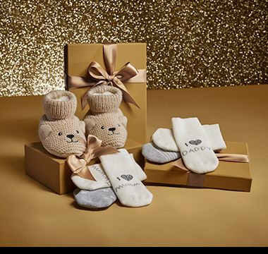 A selection of baby socks and Spencer Bear booties. Shop baby gifts