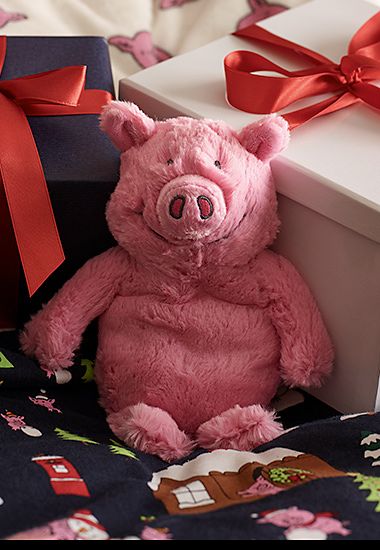 Bedroom showing Percy Pig bedding and Percy Pig hottie. Shop Percy Pig gifts 