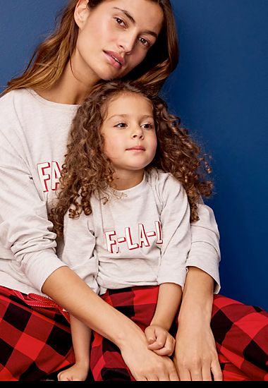 Mother and daughter wearing matching family pyjamas. Shop now 