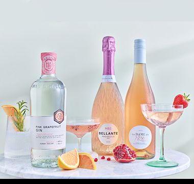 A selection of drinks in bottles and glasses. Shop drinks