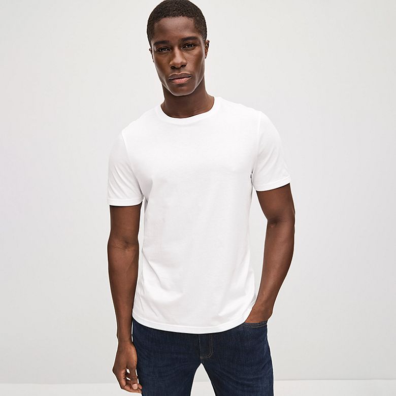 Man wearing white regular fit T-shirt. Shop regular fit T-shirts