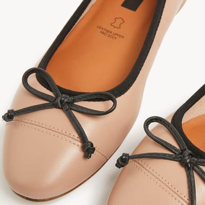 Ecru ballet pumps with dark brown trim. Shop ballet pumps