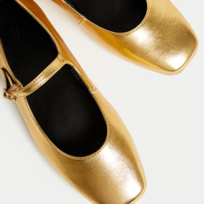 Gold Mary Jane-style ballet pumps. Shop now