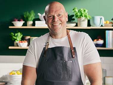 Chef Tom Kerridge smiling in kitchen