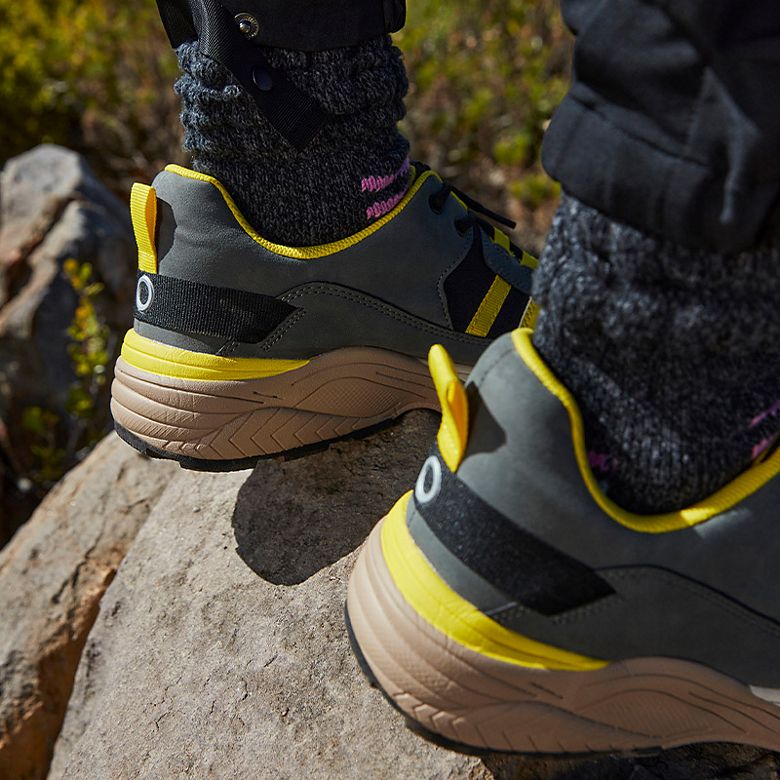 Yellow, grey, and black walking Goodmove trainers. Shop now.