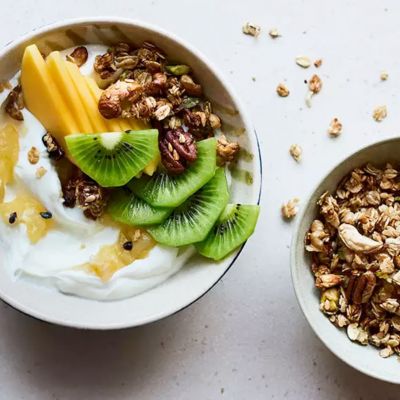 A bowl of yoghurt, fruit and granola