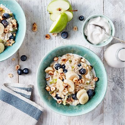 A bowl of bircher muesli topped with fresh fruit