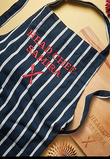 Personalised apron and wooden chopping board. Shop personalised gifts