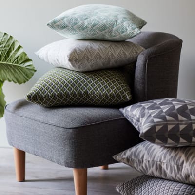 Scatter cushions in different colours on a Kerava armchair
