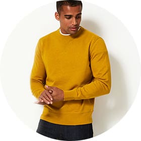 Man wearing mustard yellow knitted jumper