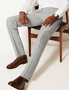 Man wearing pale grey slim-fit trousers