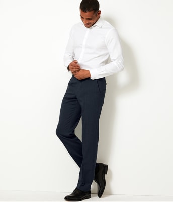 Man wearing navy blue tailored-fit trousers