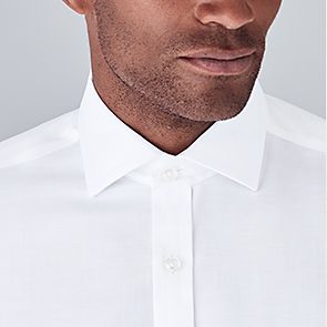 Man wearing cut-away collar shirt