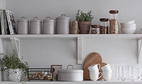 Kitchen shelves with utensils and dinnerware