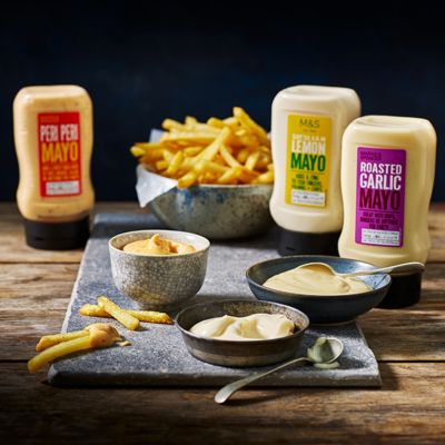 A selection of flavoured mayonnaises with chips